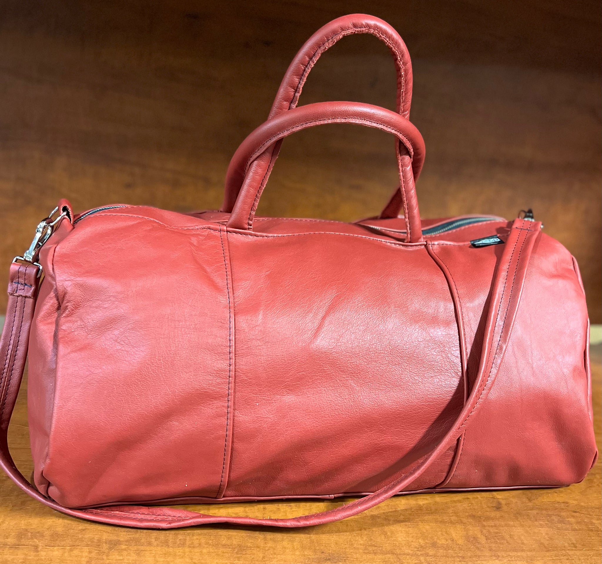 Pink leather 2025 duffle bag